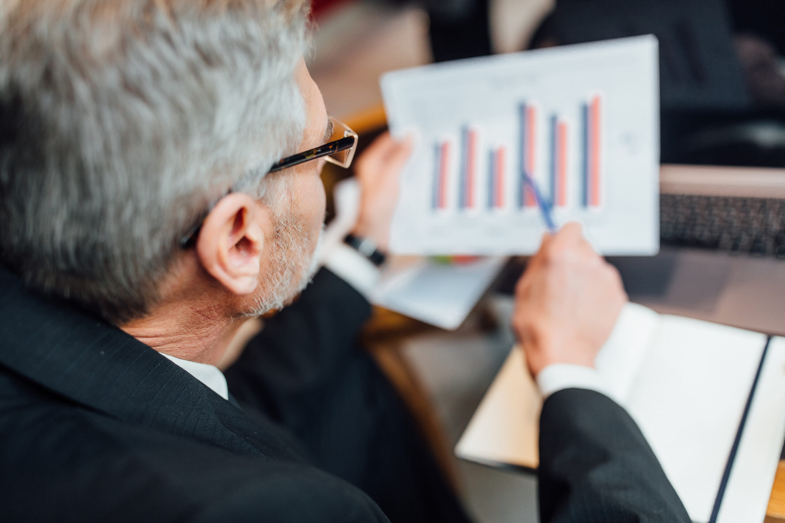 A man analyzing the cost benefits of PPLI and deciding when it makes financial sense