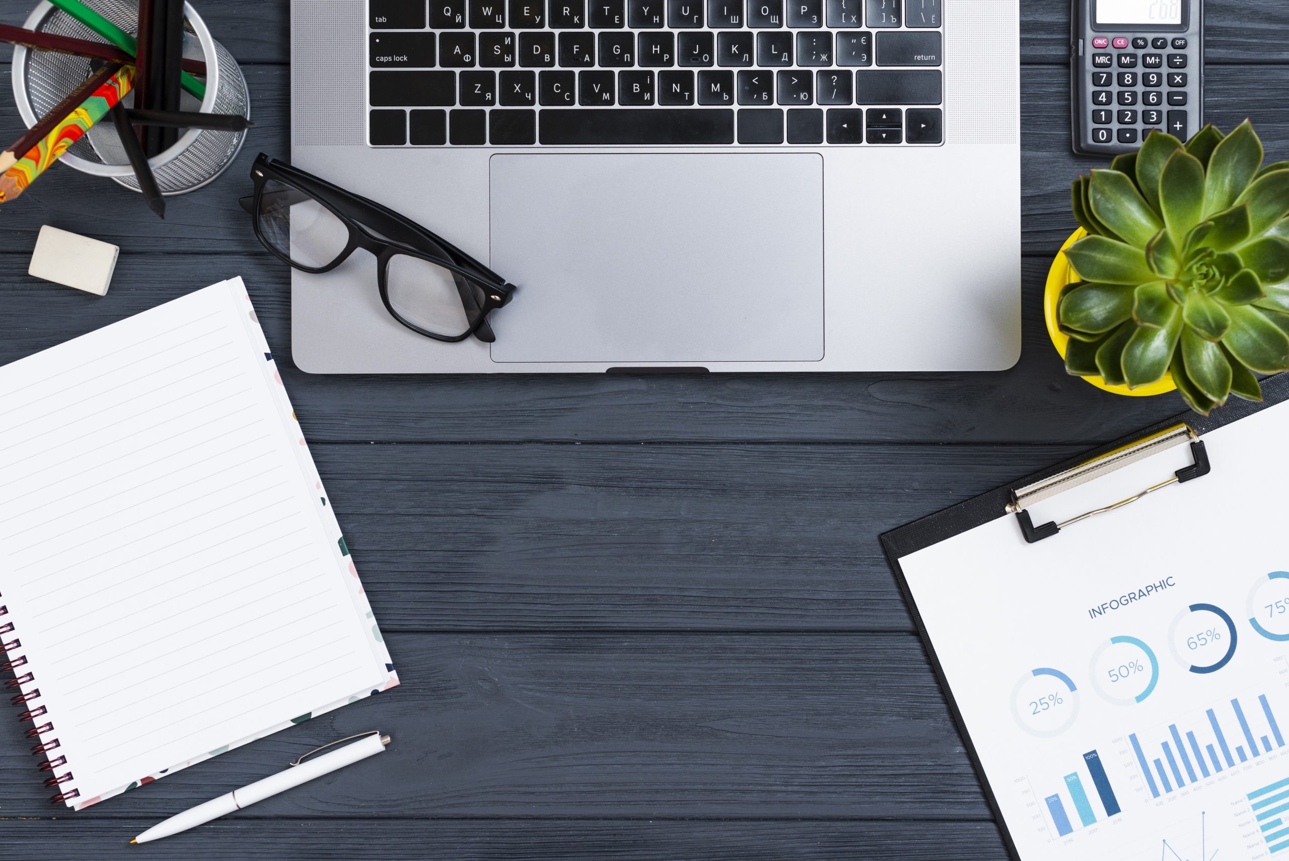 Professional financial planning workspace with laptop, calculator, charts and infographics showing percentage breakdowns and bar graphs for PPLI death benefit analysis